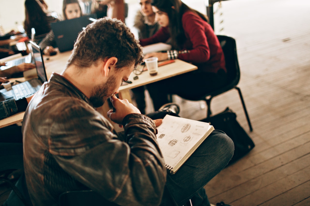 a guy looking at his notes