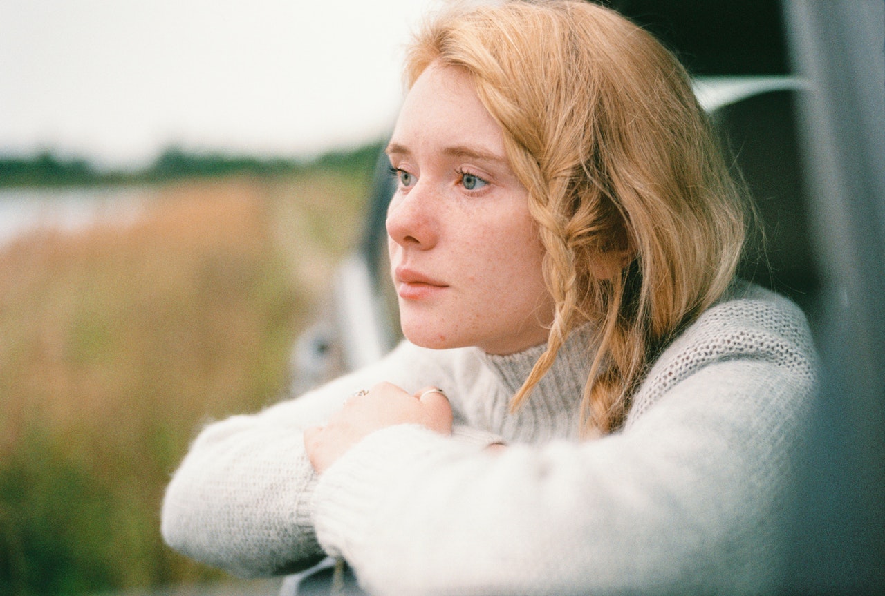 a girl in a car window