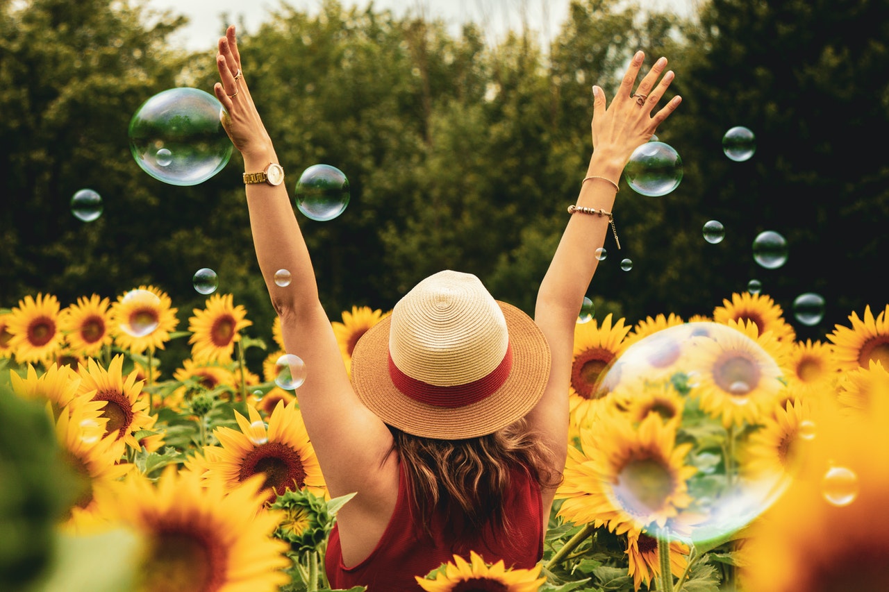 a girl among sunflowers